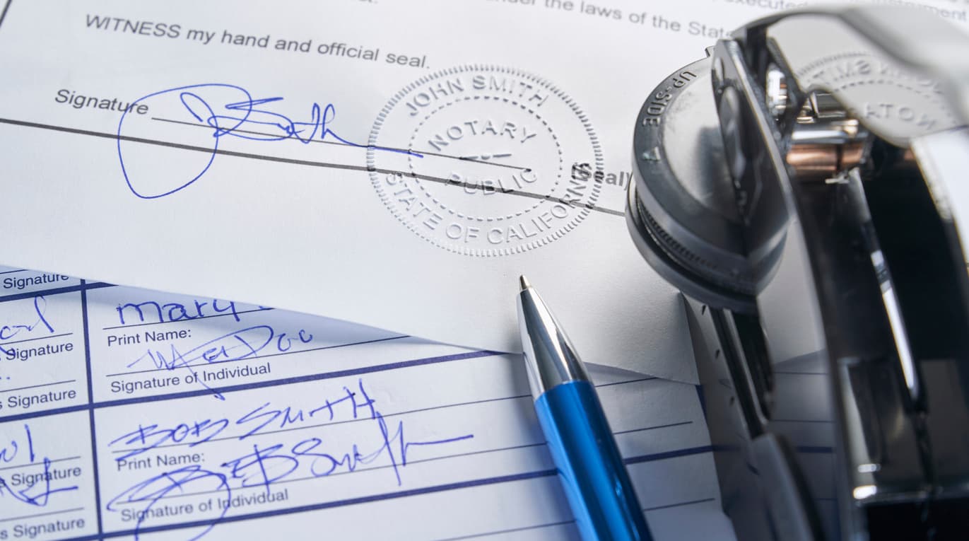 Close-up of a notarized utility bill with signature, notary public stamp, and embosser tool — representing secure proof of address through official notarization or Apostille for international or legal use.